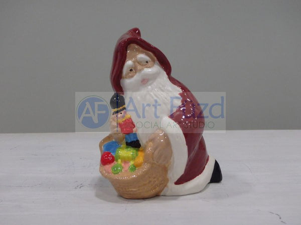 Small Hooded Santa kneeling with Toys and Toy Soldier Figurine ~ 3.25 x 2.25 x 4