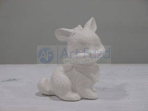Small Sitting Bunny with Bow in Hair Looking Right