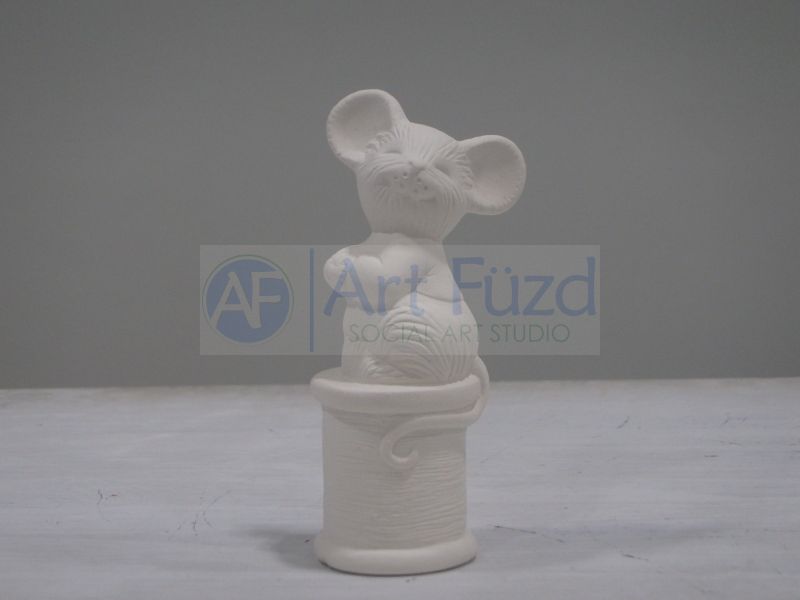 Small Mouse Atop a Spool of Thread